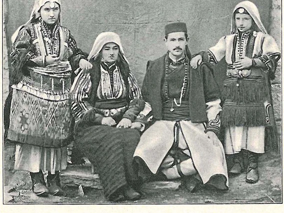 A black and white photograph by Spiridon Gopčević, showing a family in traditional dress from Old Serbia. Mother and father are sitting, flanked by their daughters, who are standing.